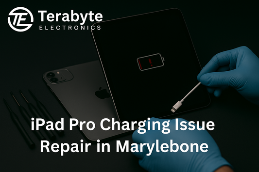 iPad Pro charging issue repair in Marylebone – Terabyte Electronics blog banner showing technician testing tablet with charging cable and low battery warning