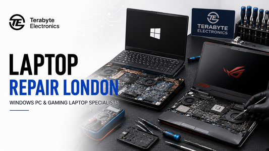 Technician repairing Windows and gaming laptops on an anti-static workbench at Terabyte Electronics laptop repair workshop in London.