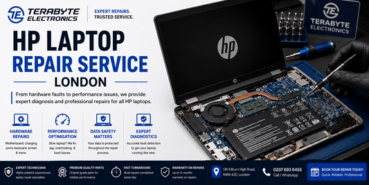 Technician repairing an HP Spectre laptop screen and motherboard in London workshop