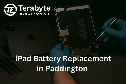 iPad battery replacement service in Paddington by Terabyte Electronics – technician repairing tablet with tools on desk